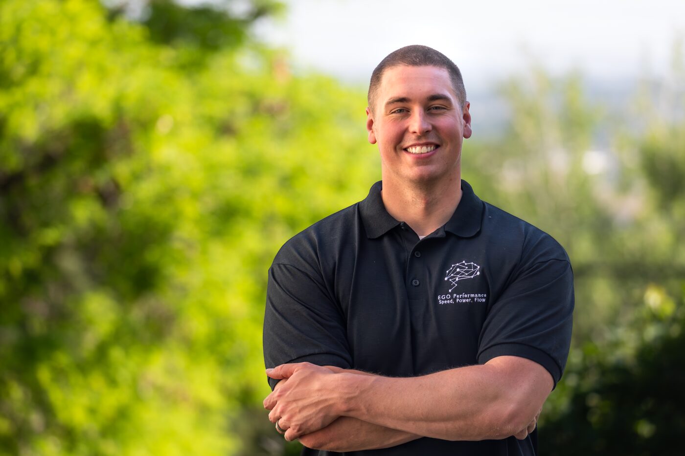 Chase Collins, founder of EGO Performance, in an EGO Performance polo at the ATLAS Performance Complex